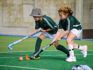 Girls playing hockey