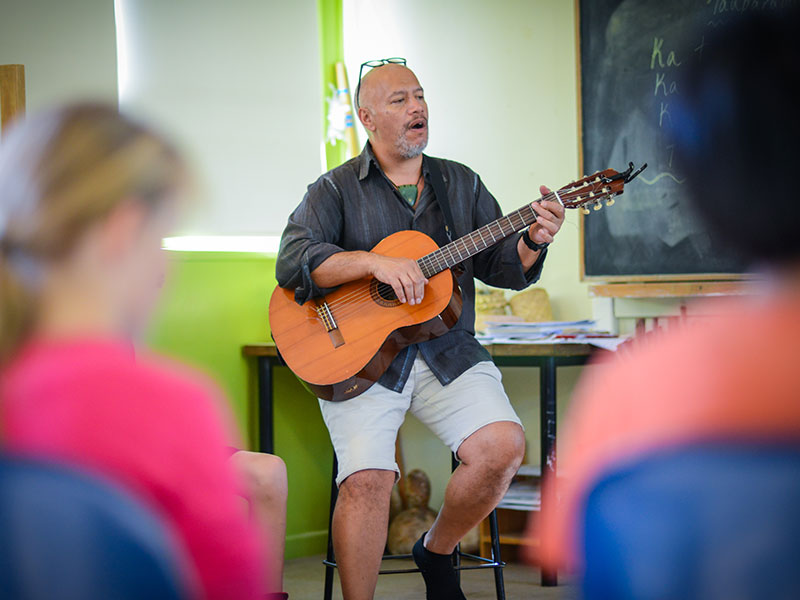 Teacher singing in Maori class
